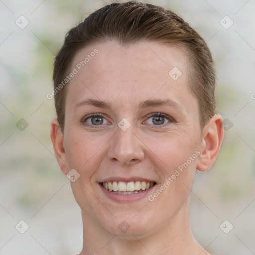 Joyful white young-adult female with short  brown hair and grey eyes