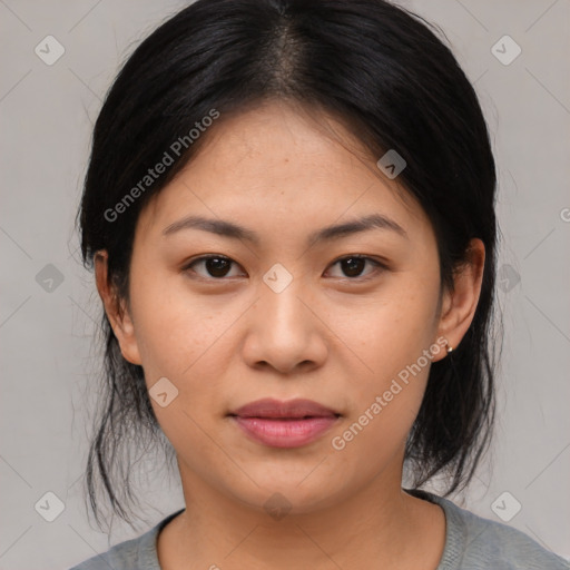 Joyful asian young-adult female with medium  black hair and brown eyes