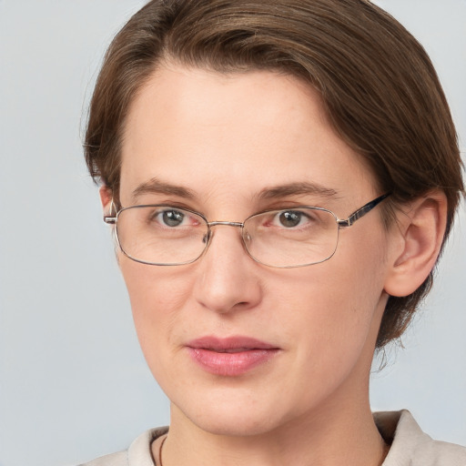 Joyful white adult female with short  brown hair and brown eyes