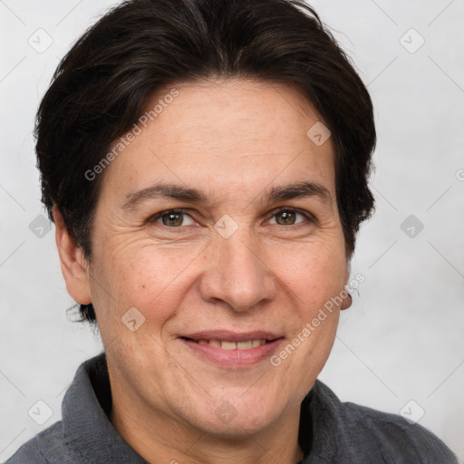 Joyful white adult female with short  brown hair and brown eyes