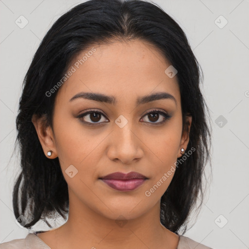 Joyful latino young-adult female with medium  brown hair and brown eyes