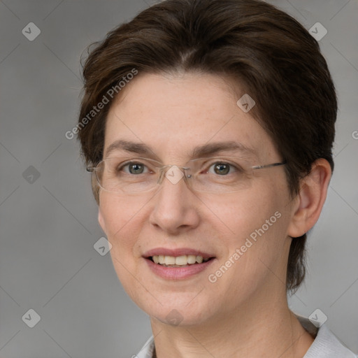 Joyful white adult female with medium  brown hair and grey eyes