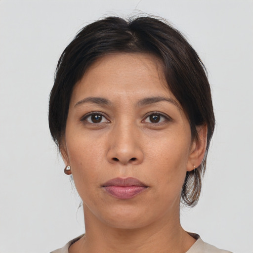Neutral asian adult female with medium  brown hair and brown eyes