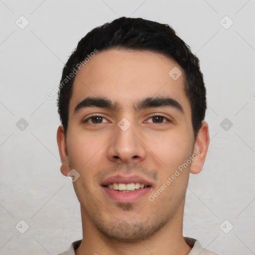 Joyful white young-adult male with short  black hair and brown eyes