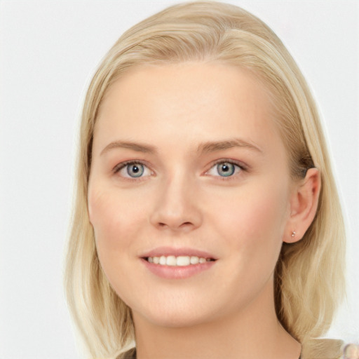 Joyful white young-adult female with long  brown hair and blue eyes