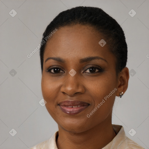 Joyful black young-adult female with short  black hair and brown eyes