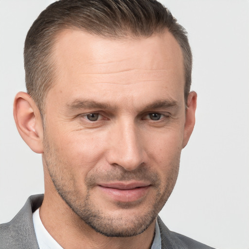 Joyful white adult male with short  brown hair and brown eyes