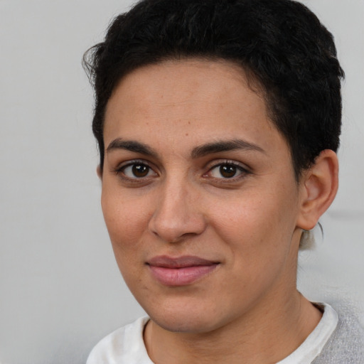 Joyful white young-adult female with short  brown hair and brown eyes