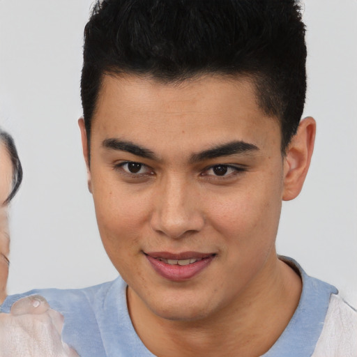 Joyful asian young-adult male with short  brown hair and brown eyes