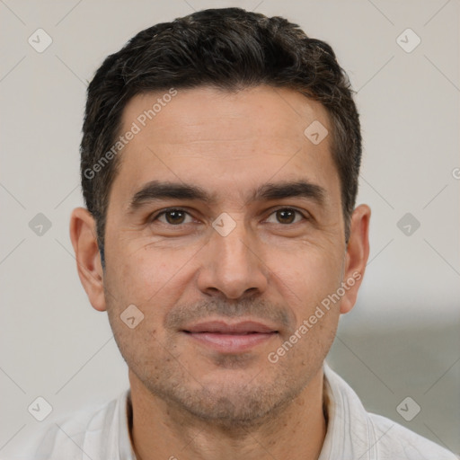 Joyful white adult male with short  brown hair and brown eyes