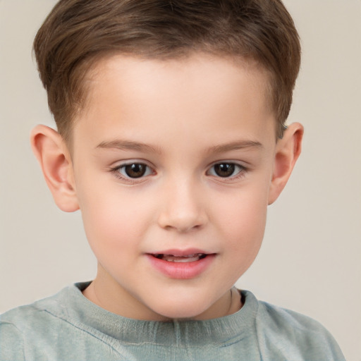 Joyful white child male with short  brown hair and brown eyes