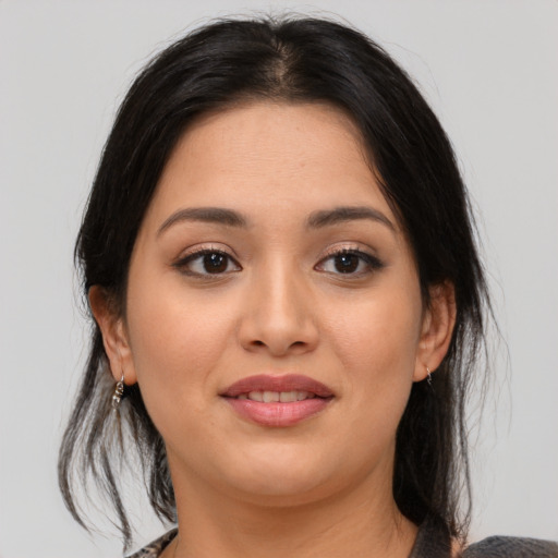 Joyful asian young-adult female with medium  brown hair and brown eyes