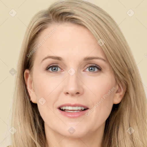 Joyful white young-adult female with long  brown hair and blue eyes