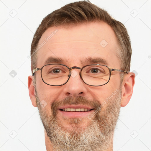 Joyful white adult male with short  brown hair and brown eyes