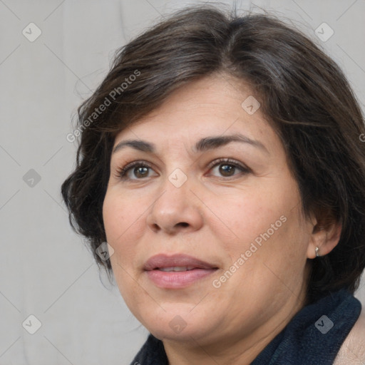 Joyful white adult female with medium  brown hair and brown eyes