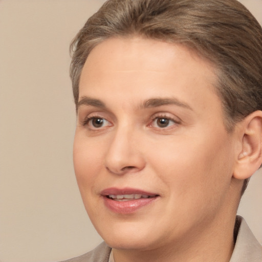 Joyful white adult female with short  brown hair and brown eyes