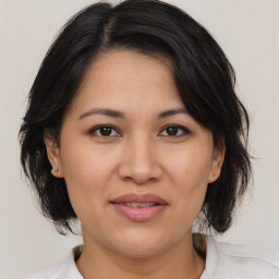 Joyful white adult female with medium  brown hair and brown eyes