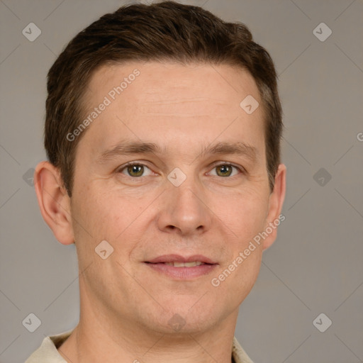 Joyful white adult male with short  brown hair and grey eyes