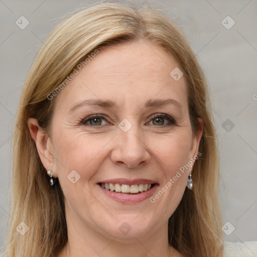 Joyful white adult female with long  brown hair and grey eyes