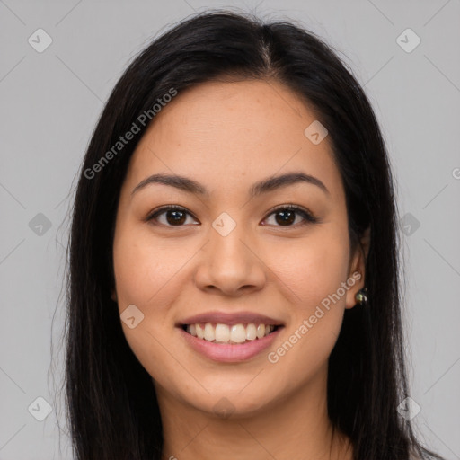 Joyful latino young-adult female with long  brown hair and brown eyes