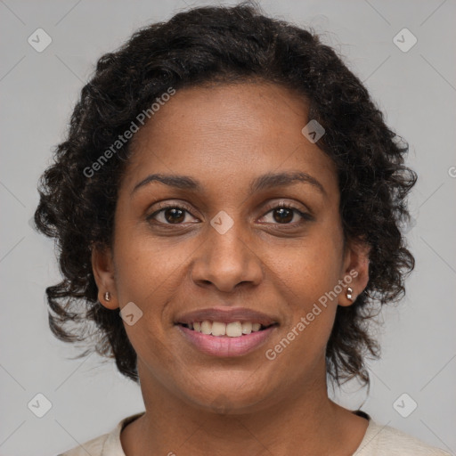 Joyful black young-adult female with medium  brown hair and brown eyes