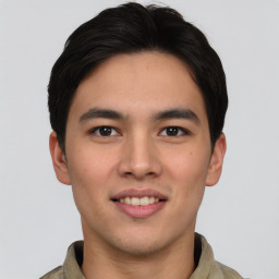 Joyful asian young-adult male with short  black hair and brown eyes