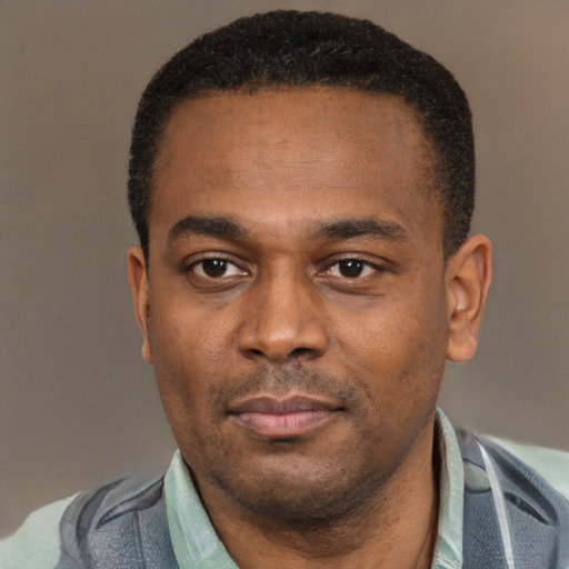 Neutral latino adult male with short  black hair and brown eyes