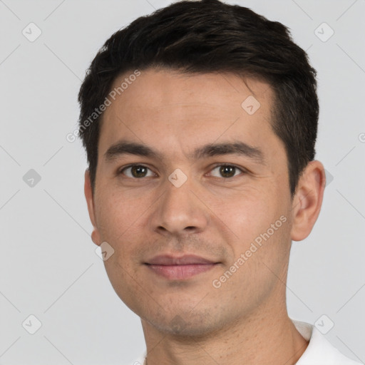 Joyful white young-adult male with short  black hair and brown eyes