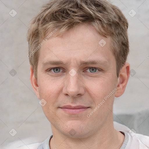 Joyful white adult male with short  brown hair and grey eyes