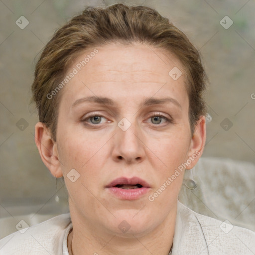 Joyful white adult female with short  brown hair and grey eyes