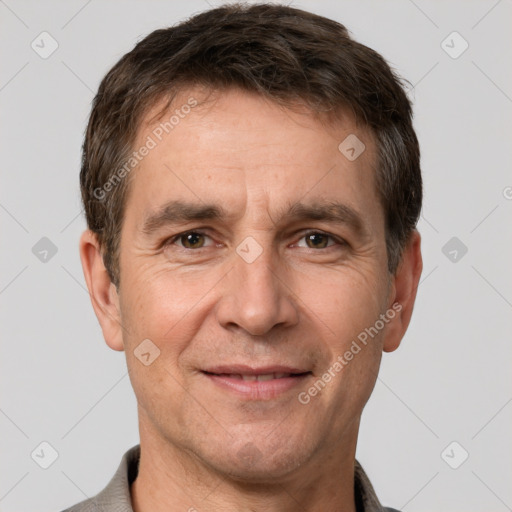 Joyful white adult male with short  brown hair and brown eyes