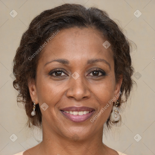 Joyful black adult female with medium  brown hair and brown eyes