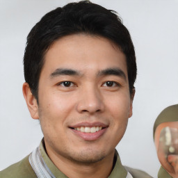 Joyful white young-adult male with short  black hair and brown eyes