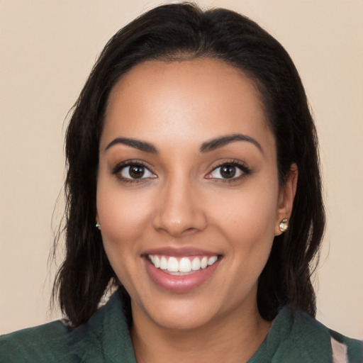 Joyful latino young-adult female with long  black hair and brown eyes