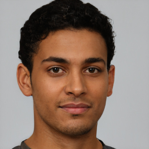 Neutral latino young-adult male with short  brown hair and brown eyes