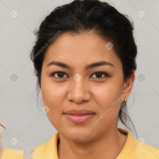 Joyful latino young-adult female with medium  brown hair and brown eyes