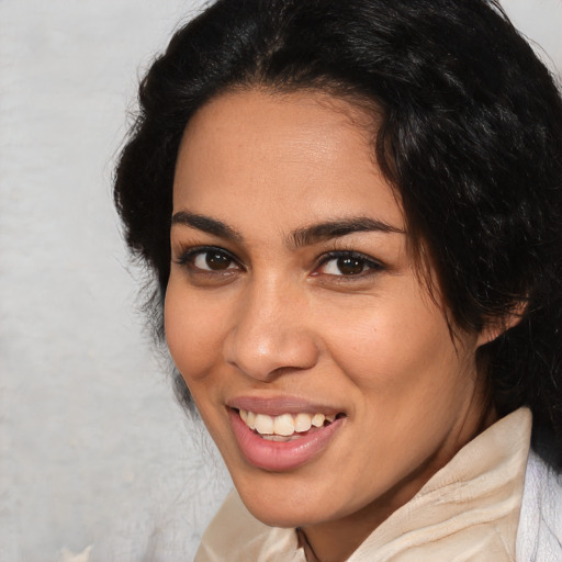Joyful latino young-adult female with medium  brown hair and brown eyes