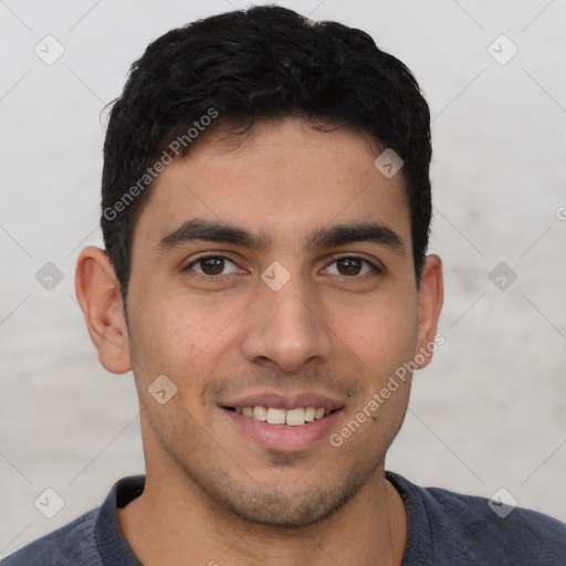 Joyful white young-adult male with short  black hair and brown eyes