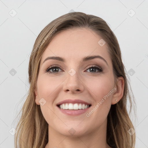 Joyful white young-adult female with long  brown hair and grey eyes