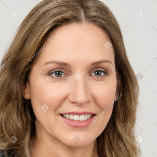 Joyful white young-adult female with long  brown hair and green eyes