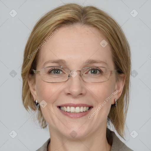 Joyful white adult female with medium  brown hair and blue eyes