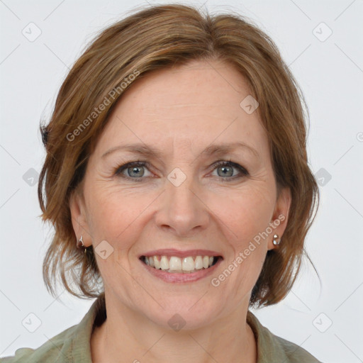 Joyful white adult female with medium  brown hair and grey eyes