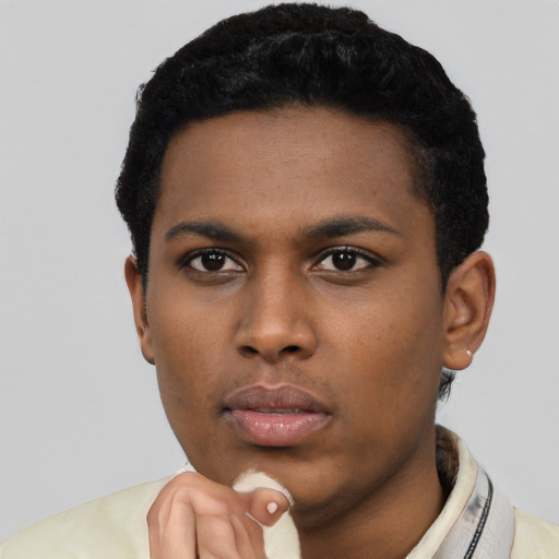 Neutral latino young-adult male with short  black hair and brown eyes