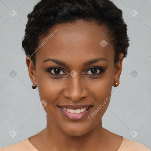 Joyful black young-adult female with short  brown hair and brown eyes