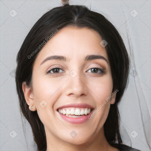 Joyful white young-adult female with long  black hair and brown eyes