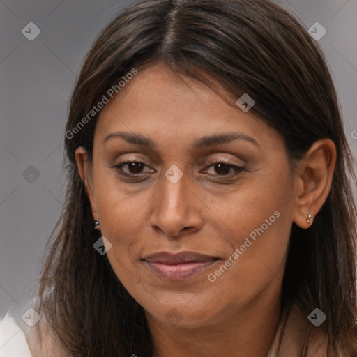 Joyful white adult female with long  brown hair and brown eyes