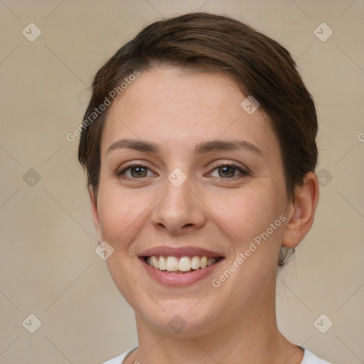 Joyful white young-adult female with short  brown hair and brown eyes