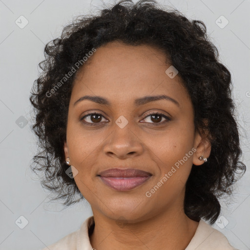 Joyful black young-adult female with medium  brown hair and brown eyes