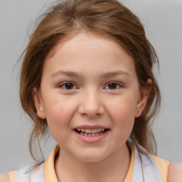 Joyful white child female with medium  brown hair and brown eyes