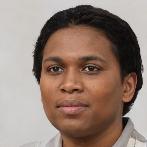 Neutral black young-adult female with short  black hair and brown eyes
